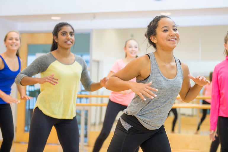 Girls Dancing Together in Zumba Class